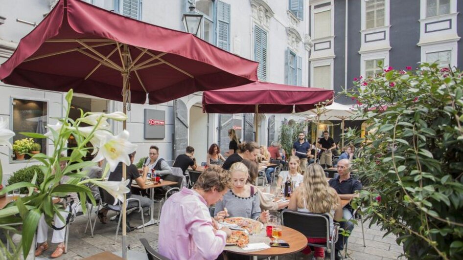 L'Osteria - Gemütlicher Gastgarten | © L'Osteria