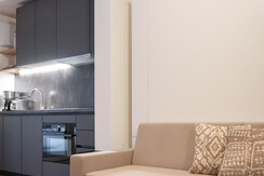 BASE 2.07 | a bed at night and a couch during the day