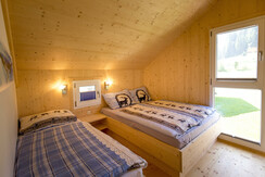 A bright and inviting bedroom with 3 single beds