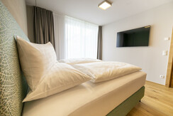 Apartments Weitblick Dorfhotel Fasching Schlafzimm