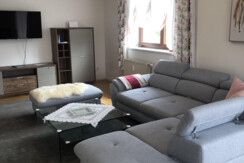 Living room with large, cosy couch