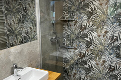 app. Orange bathroom with view into the bedroom