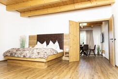 Double bed in the small apartment