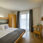 Photo of single room with balcony | © JUFA Hotel Deutschlandsberg