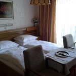 Photo of triple room with shower, bath tub, WC