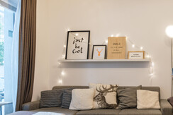 Cozy sofa and access to the balcony