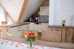Dining table, view into the kitchen