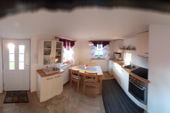 Küche und Wohnbereich Ferienhaus Legat