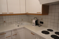 Küche mit Espressomaschine im rechten Apparatement