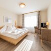 Photo of Kuscheltage, Junior suite, shower, toilet, living room/bedroom | © Hotel Grimmingblick