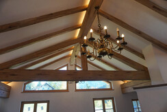 Visible roof truss with chandelier